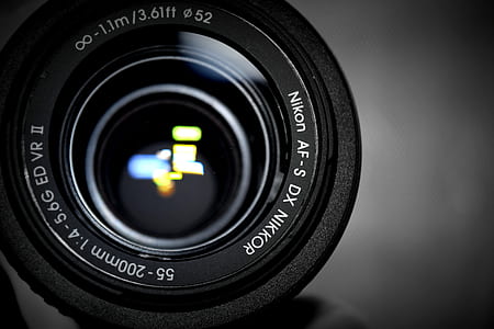 black Nikon camera lens thumbnail