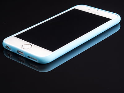 silver iPhone 6 and white case thumbnail