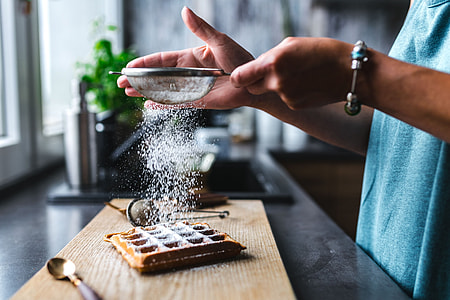 Breakfast waffles with fresh raspberries and powdered sugar thumbnail