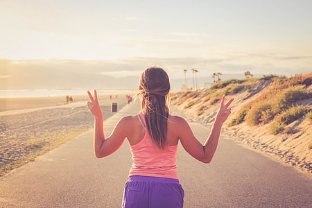 Woman running on beach thumbnail