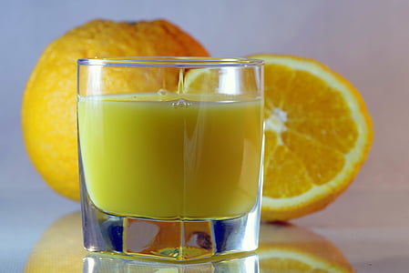 clear drinking glass with orange juice thumbnail