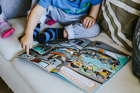 Child reading a comic story thumbnail
