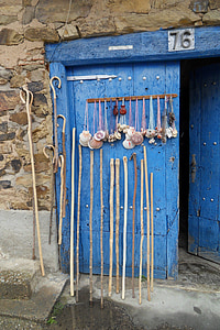 hand canes leaned on blue door thumbnail