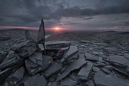 pile of gray rocks during sunset thumbnail