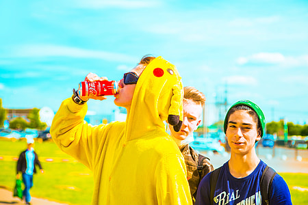 man drinking from a drink can while wearing Pikachu costume thumbnail