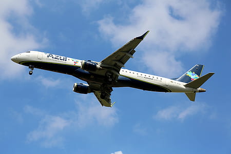 white Azul airplane under white clouds and blue sky thumbnail