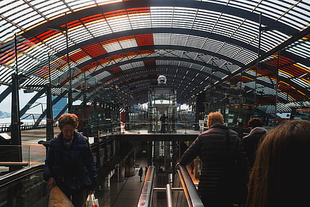people in riding escalator thumbnail