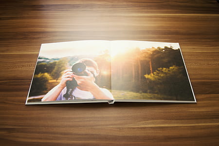 man holding black DSLR camera photograph thumbnail