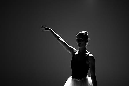 grayscale photography of ballerina raising right hand thumbnail