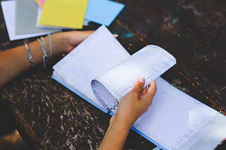 person holding notebook thumbnail