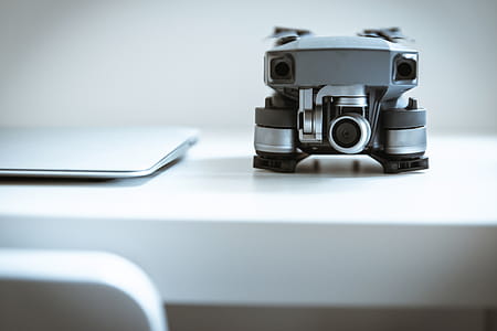 Modern drone with camera on white table at the office thumbnail