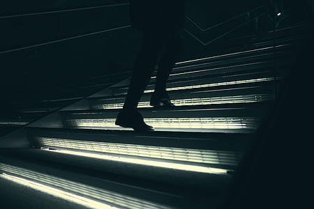 silhouette of man stepping stair thumbnail