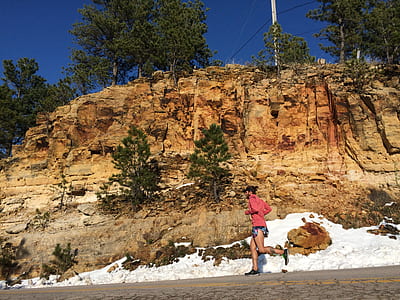 man jogging near hill thumbnail