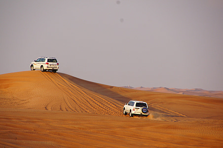 two white SUV on desert thumbnail