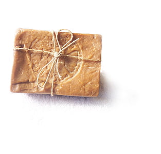 bar of brown soap on white surface thumbnail