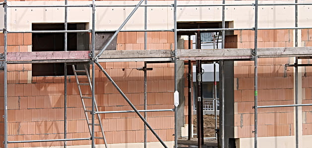 brown and white concrete building at daytime thumbnail