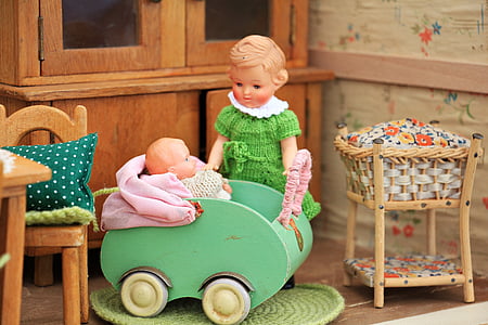 girl and baby doll photograph thumbnail