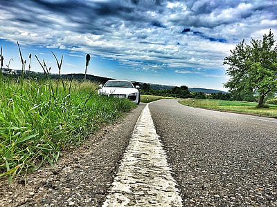 white vehicle on grass near tree thumbnail