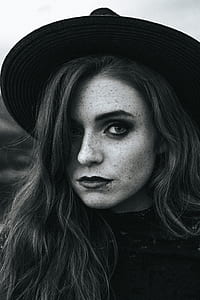 grayscale portrait photography of woman in hat thumbnail