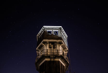 low angle photography of gray concrete tower thumbnail