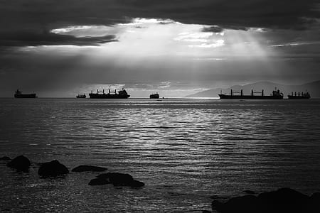 grayscale photo of ship on sea thumbnail