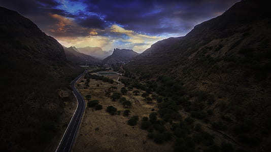 aerial photography of road between mountains thumbnail