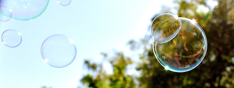 low angle photo of clear bubbles during daylight thumbnail