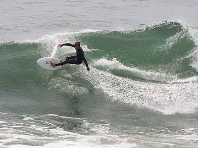 man surfing on sea wave on focus photo thumbnail