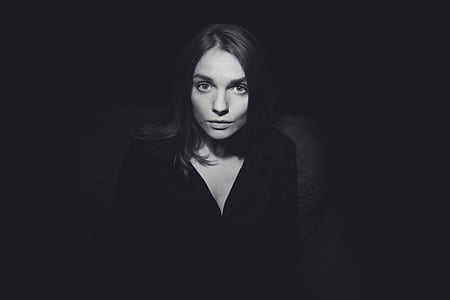 grayscale photography of woman wearing black V-neck top thumbnail