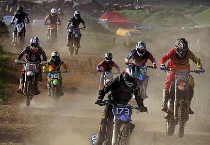 people racing on motocross dirt bikes thumbnail