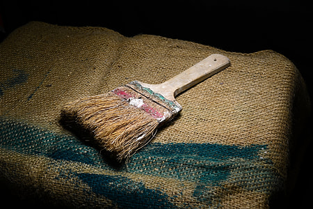 paint brush on top of brown textile thumbnail