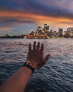 photo of person reaching Sydney, Opera House thumbnail