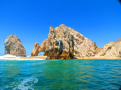 brown cliff near body of water thumbnail