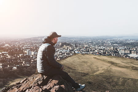 man sitting on top of rock thumbnail