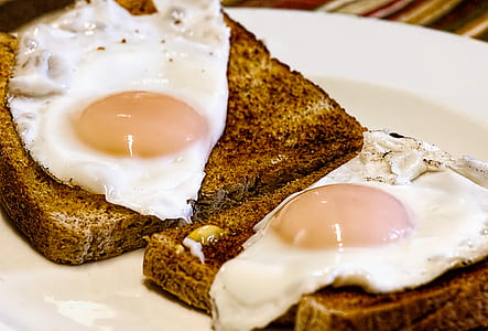 two sunny sideup egg on brown breads thumbnail