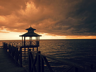 brown wooden dock during dusk thumbnail