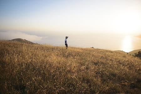 person standing on hilltop thumbnail