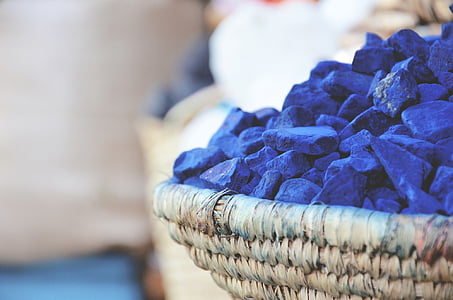 selective focus of a basket of blue stones thumbnail