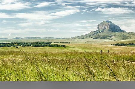 grass field near hill thumbnail