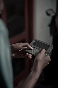 person holding Nokia flip phone thumbnail