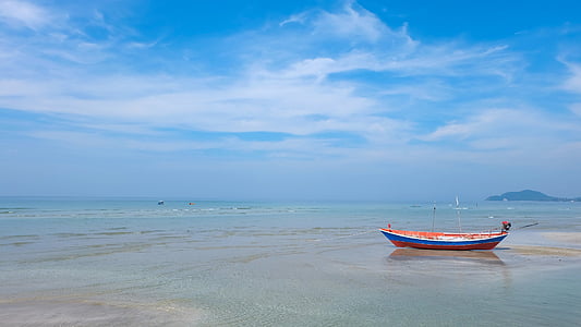 white and blue boat on body of water under blue and white sky thumbnail