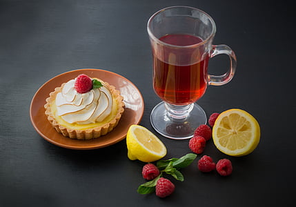clear glass cup beside brown ceramic plate thumbnail
