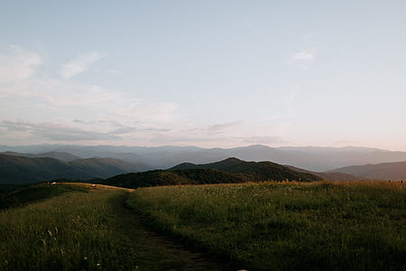 landscape photo of green grass and mountain thumbnail