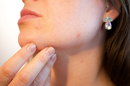 woman wearing silver earrings thumbnail