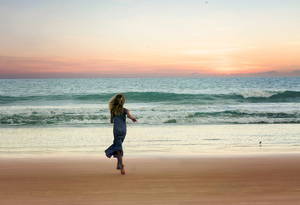 Girl running on the beach thumbnail