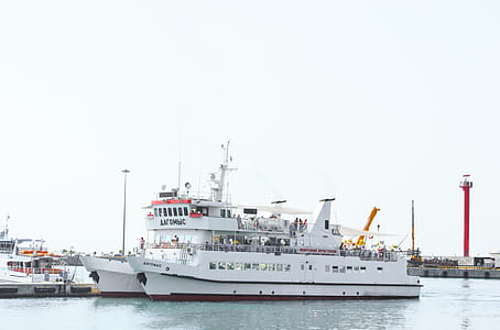 White Commuter Boat on Body of Water thumbnail