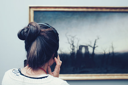 woman facing on tree painting inside the room thumbnail