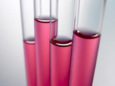 four clear vials with pink liquids thumbnail