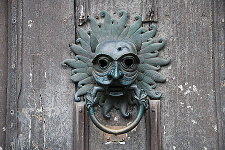 close-up of gray tribal door knocker thumbnail