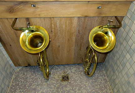two brass-colored trumpets at the shower room thumbnail